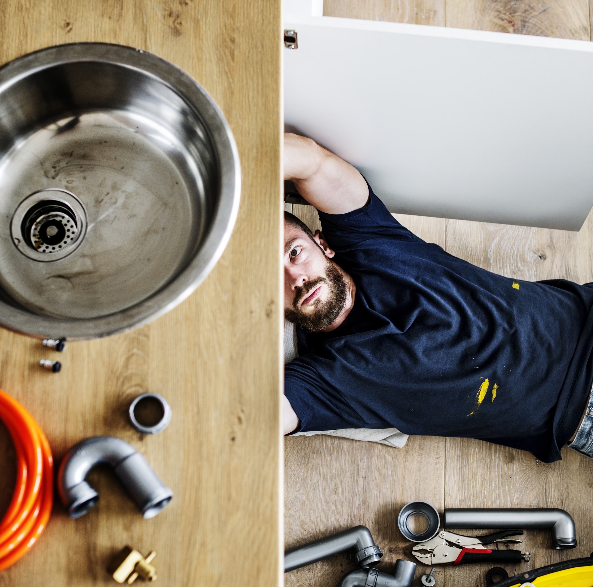 Man fixing kitchen sink